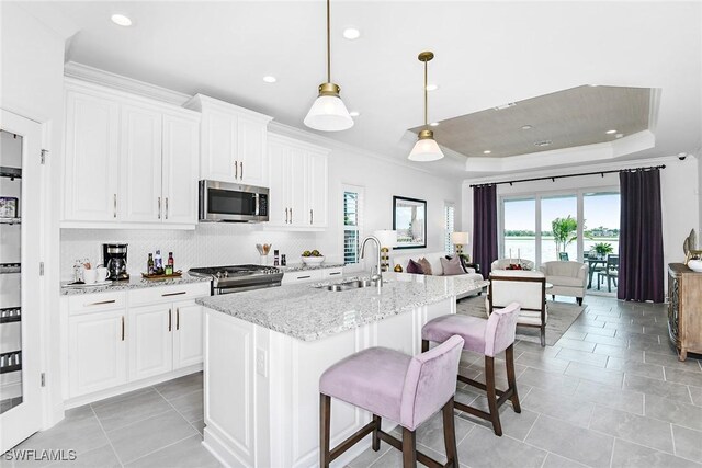 2949 Heritage Pines Dr, Fort Myers, FL 33905 - kitchen featuring appliances with stainless steel finishes, a sink, plenty of natural light, decorative backsplash, and recessed lighting