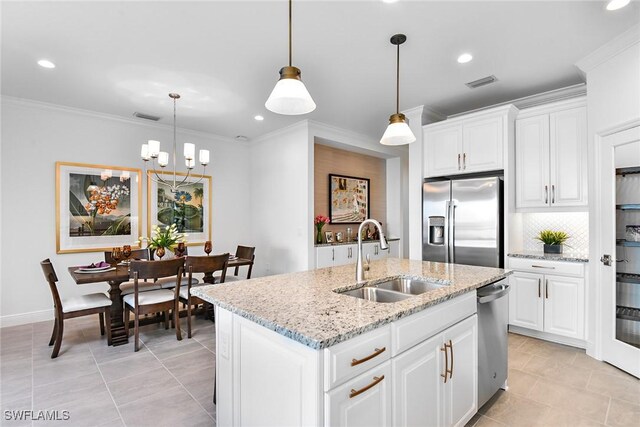 2949 Heritage Pines Dr, Fort Myers, FL 33905 - kitchen featuring stainless steel appliances, a sink, recessed lighting, a kitchen island with sink, and ornamental molding