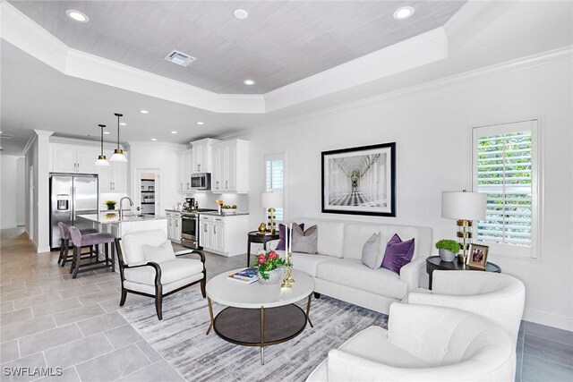 2949 Heritage Pines Dr, Fort Myers, FL 33905 - living room featuring a raised ceiling, crown molding, recessed lighting, baseboards, and light tile patterned floors