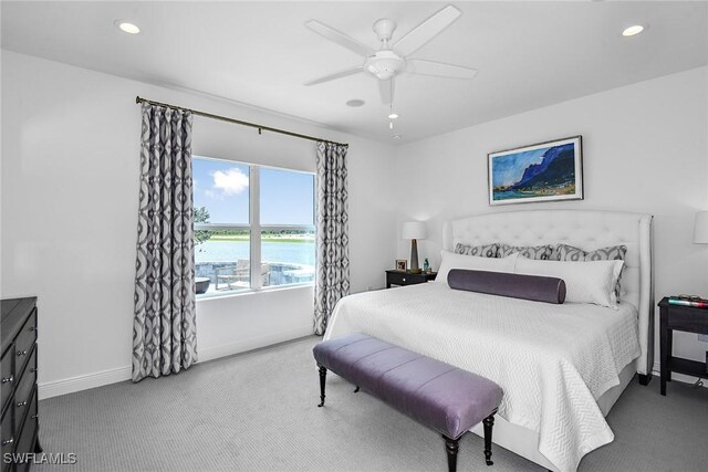 2949 Heritage Pines Dr, Fort Myers, FL 33905 - bedroom featuring carpet flooring, baseboards, recessed lighting, a ceiling fan, and a water view