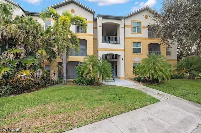 11541 Villa Grand Unit 817, Fort Myers, FL 33913 - view of front of house with a front lawn and stucco siding