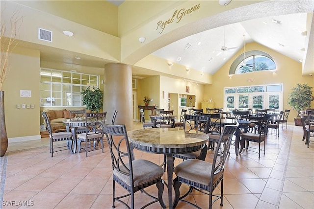 11541 Villa Grand Unit 817, Fort Myers, FL 33913 - dining space with a ceiling fan, visible vents, light tile patterned floors, high vaulted ceiling, and baseboards