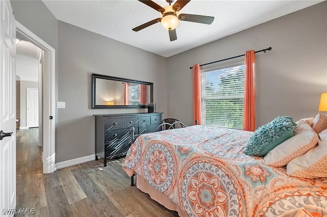 11541 Villa Grand Unit 817, Fort Myers, FL 33913 - bedroom featuring baseboards, ceiling fan, and wood finished floors