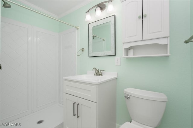 bathroom featuring walk in shower, toilet, ornamental molding, and vanity