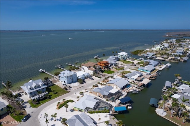 bird's eye view featuring a residential view and a water view