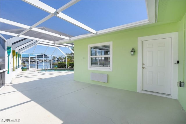 view of patio / terrace with an outdoor pool and a lanai
