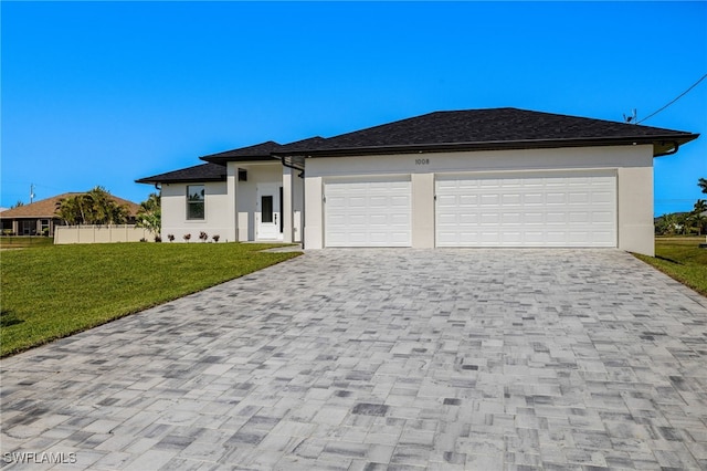 1008 NW 36th Pl, Cape Coral, FL 33993 - prairie-style house featuring decorative driveway, stucco siding, and a front yard