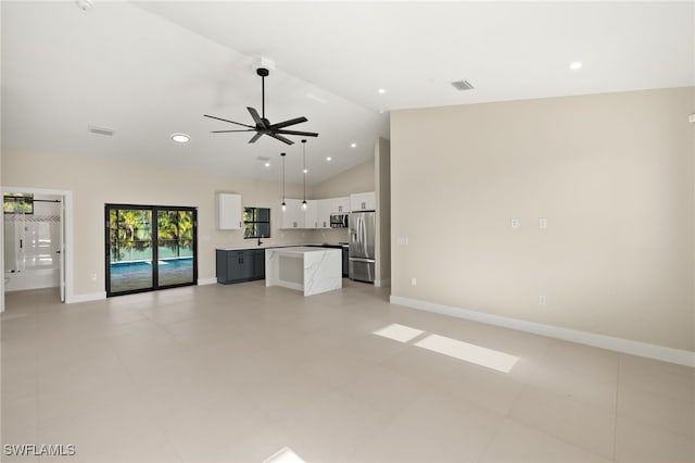 1008 NW 36th Pl, Cape Coral, FL 33993 - unfurnished living room featuring baseboards, a ceiling fan, high vaulted ceiling, and visible vents