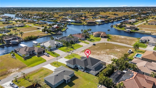 1008 NW 36th Pl, Cape Coral, FL 33993 - drone / aerial view with a residential view and a water view