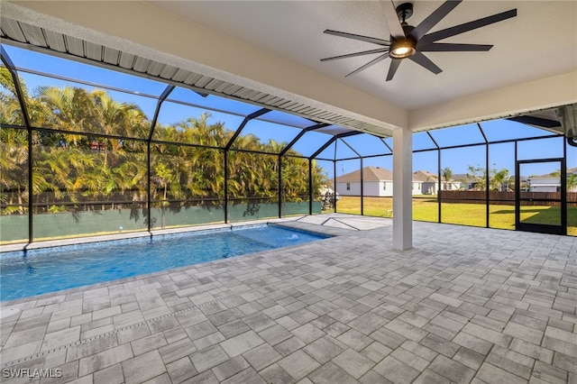 1008 NW 36th Pl, Cape Coral, FL 33993 - outdoor pool featuring a patio, ceiling fan, a lawn, and glass enclosure