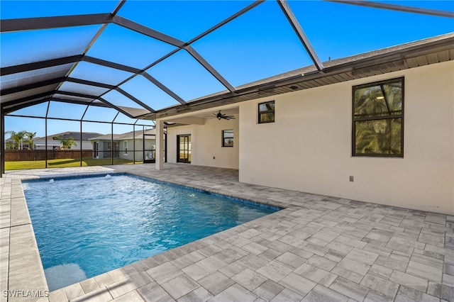 1008 NW 36th Pl, Cape Coral, FL 33993 - outdoor pool with a lanai, a ceiling fan, a patio, and a yard