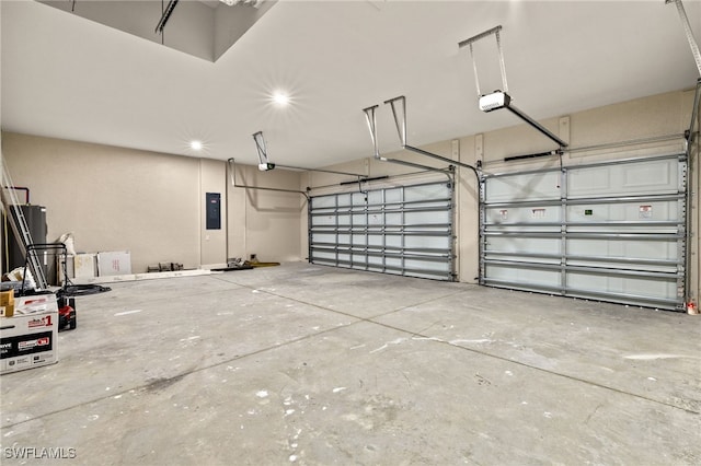 1008 NW 36th Pl, Cape Coral, FL 33993 - garage featuring a garage door opener, recessed lighting, and electric panel