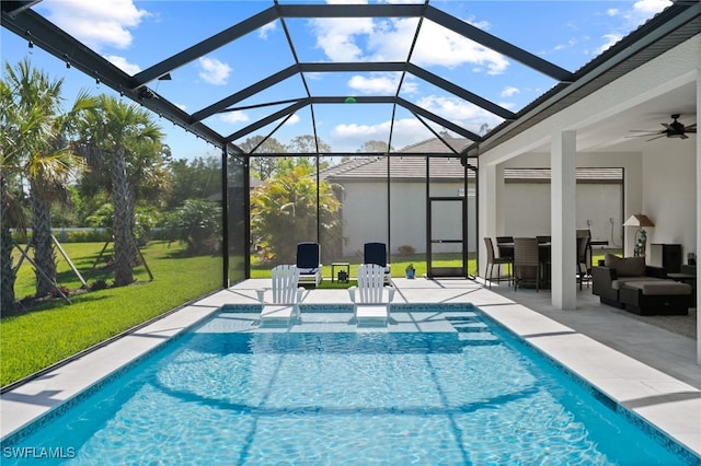 11498 Tiverton Trce, Fort Myers, FL 33913 - swimming pool with a lawn, a patio area, a ceiling fan, a lanai, and an outdoor hangout area