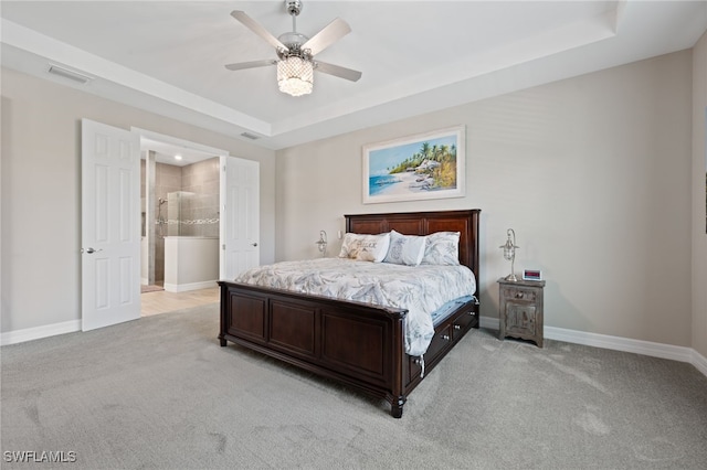 11498 Tiverton Trce, Fort Myers, FL 33913 - bedroom featuring a tray ceiling, light colored carpet, and baseboards