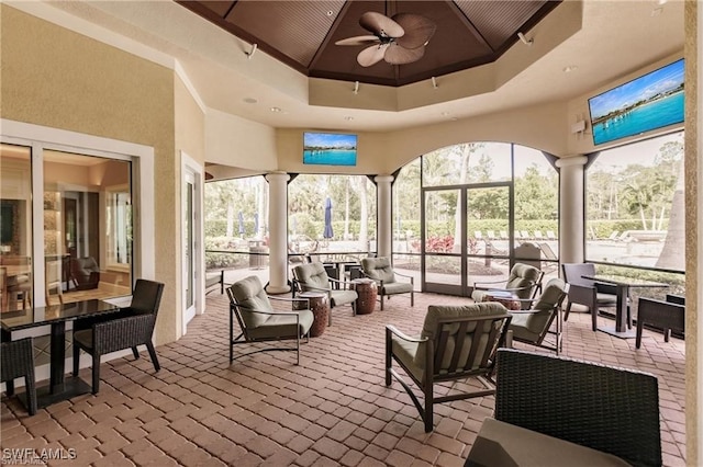 11498 Tiverton Trce, Fort Myers, FL 33913 - sunroom / solarium featuring a towering ceiling, ornate columns, and a tray ceiling