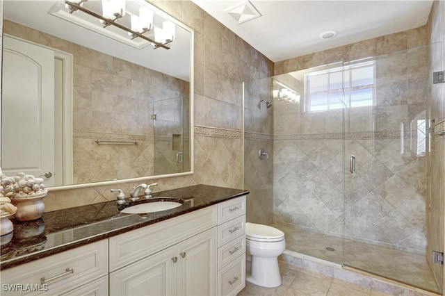 1947 Gordon River Ln, Naples, FL 34104 - bathroom with toilet, tile walls, a shower stall, and vanity