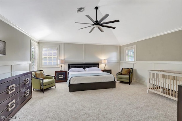 1947 Gordon River Ln, Naples, FL 34104 - carpeted bedroom with crown molding, a decorative wall, visible vents, and a wainscoted wall