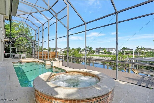1947 Gordon River Ln, Naples, FL 34104 - view of swimming pool with a lanai, a pool with connected hot tub, and a patio
