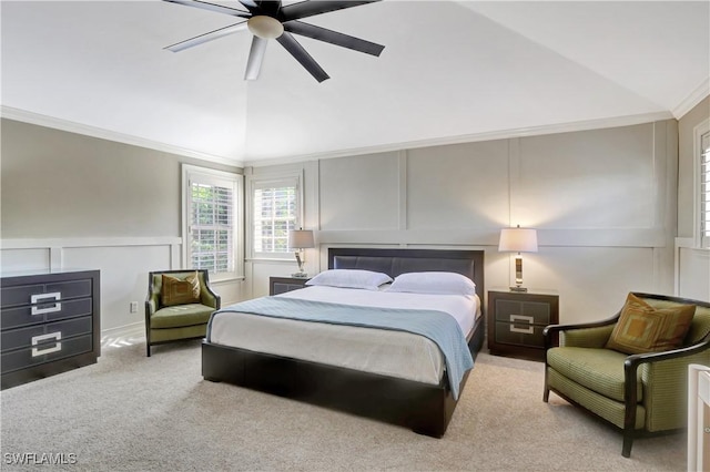1947 Gordon River Ln, Naples, FL 34104 - carpeted bedroom featuring ceiling fan, vaulted ceiling, a wainscoted wall, and a decorative wall