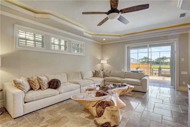 1947 Gordon River Ln, Naples, FL 34104 - living area with visible vents, ornamental molding, stone tile floors, ceiling fan, and a tray ceiling
