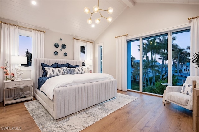 1380 Pelican Ave, Naples, FL 34102 - bedroom featuring beamed ceiling, multiple windows, light wood-style flooring, and access to exterior