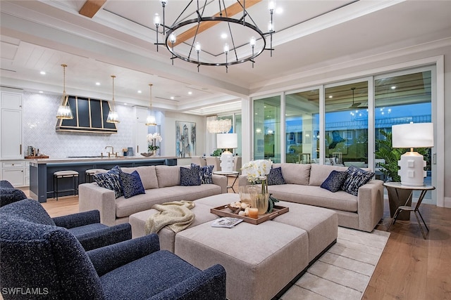1380 Pelican Ave, Naples, FL 34102 - living room with ornamental molding, recessed lighting, an inviting chandelier, and light wood-style floors