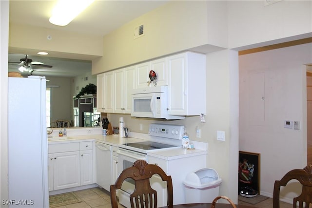 kitchen with white cabinets, a ceiling fan, white appliances, and light countertops