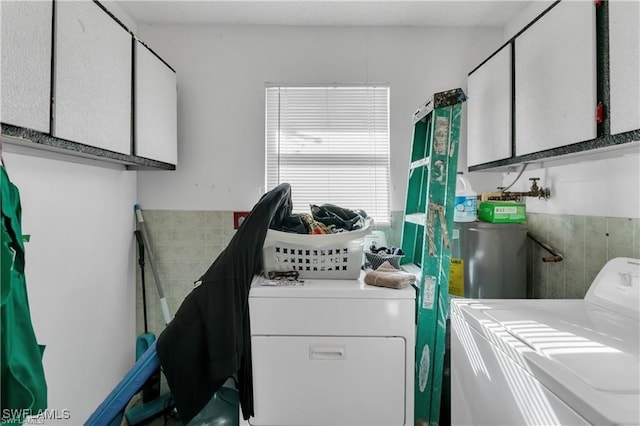 318 Bellair Rd, Fort Myers, FL 33905 - laundry room featuring separate washer and dryer and cabinet space