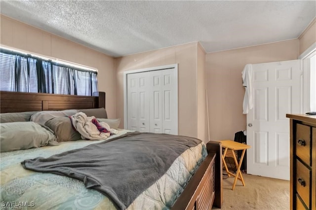318 Bellair Rd, Fort Myers, FL 33905 - bedroom with light colored carpet, a textured ceiling, and a closet