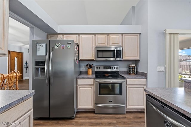 kitchen with dark wood-style floors and stainless steel appliances