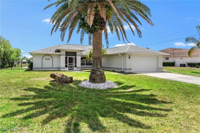 ranch-style house featuring driveway, a front yard, fence, an attached garage, and stucco siding