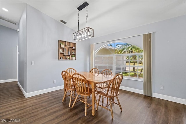 dining area with a notable chandelier, baseboards, dark wood finished floors, and visible vents