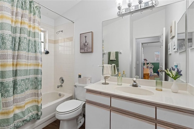 bathroom featuring vanity, shower / bath combination with curtain, and toilet