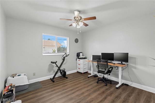 home office featuring baseboards, ceiling fan, and wood finished floors