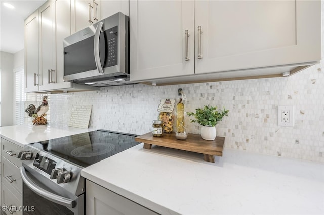 kitchen with backsplash and stainless steel appliances