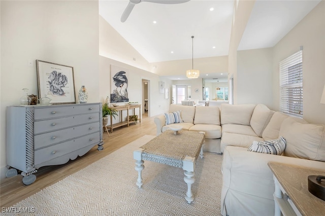 living area featuring recessed lighting, a ceiling fan, light wood-style flooring, and lofted ceiling