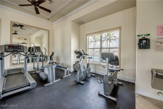 exercise room with crown molding, baseboards, ceiling fan, and visible vents