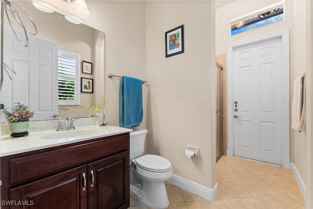 full bath featuring toilet, tile patterned flooring, vanity, and baseboards