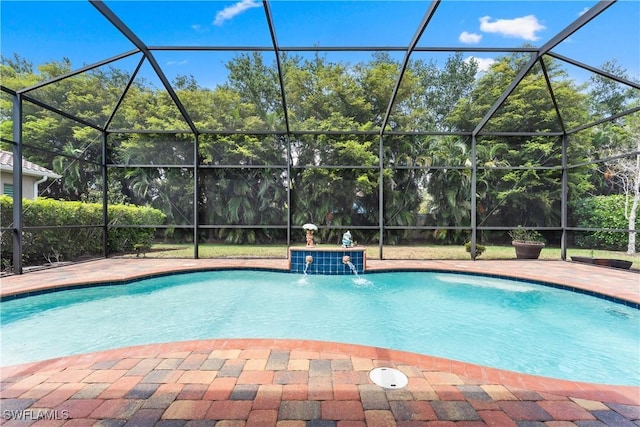 pool featuring a patio area and glass enclosure
