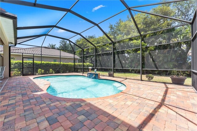 view of pool featuring a lanai, a fenced in pool, and a patio area