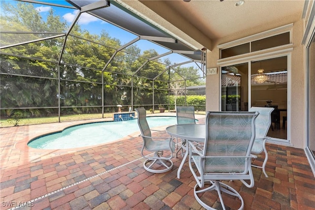 view of patio with a lanai and an outdoor pool
