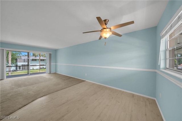 1015 Tropic Ter, North Fort Myers, FL 33903 - spare room with baseboards, a ceiling fan, and wood finished floors