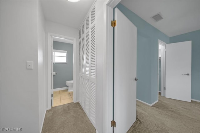 1015 Tropic Ter, North Fort Myers, FL 33903 - hall with carpet flooring, baseboards, and visible vents