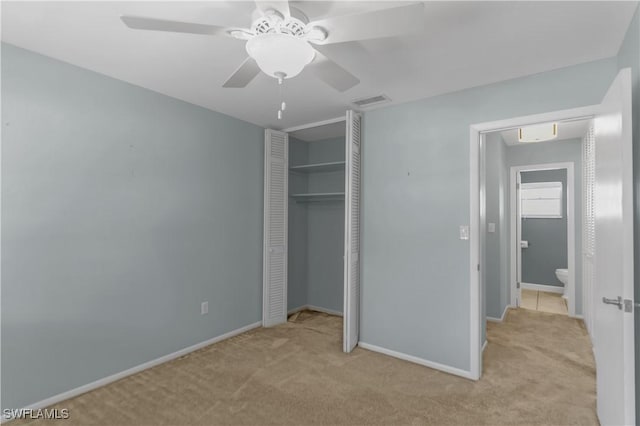 1015 Tropic Ter, North Fort Myers, FL 33903 - unfurnished bedroom featuring carpet flooring, baseboards, ceiling fan, and a closet