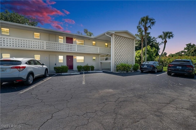 1015 Tropic Ter, North Fort Myers, FL 33903 - property at dusk with uncovered parking