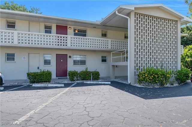 1015 Tropic Ter, North Fort Myers, FL 33903 - view of front of house with uncovered parking and stucco siding