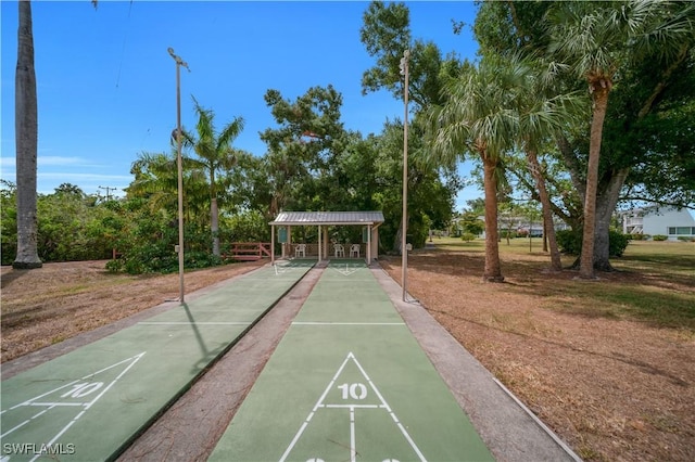 1015 Tropic Ter, North Fort Myers, FL 33903 - view of home's community with a carport and shuffleboard
