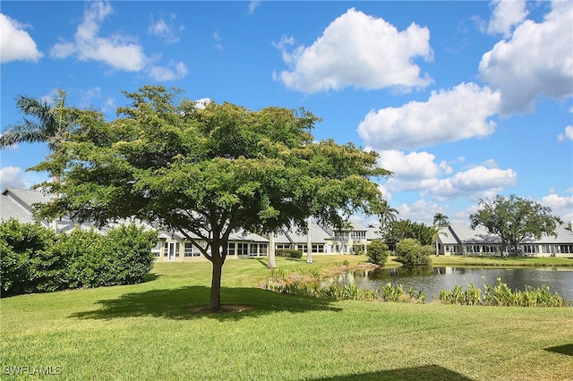 view of yard with a water view and a residential view