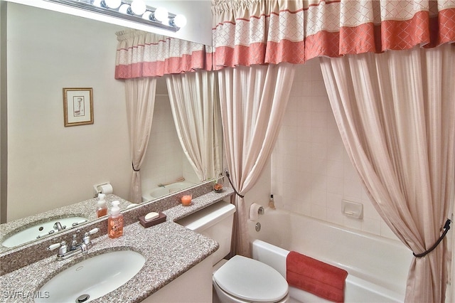 full bath featuring toilet, shower / bath combo, and vanity