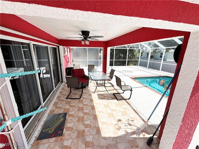 3007 NE 4th Ave, Cape Coral, FL 33909 - outdoor pool featuring glass enclosure, ceiling fan, and a patio area